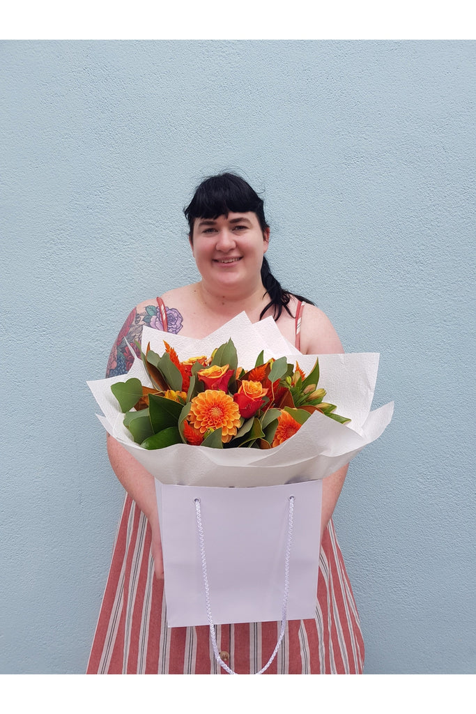 A Stunning mix of Autumn tones with lush foliage designed from seasonal flowers and foliage made by a Wellington Florist 