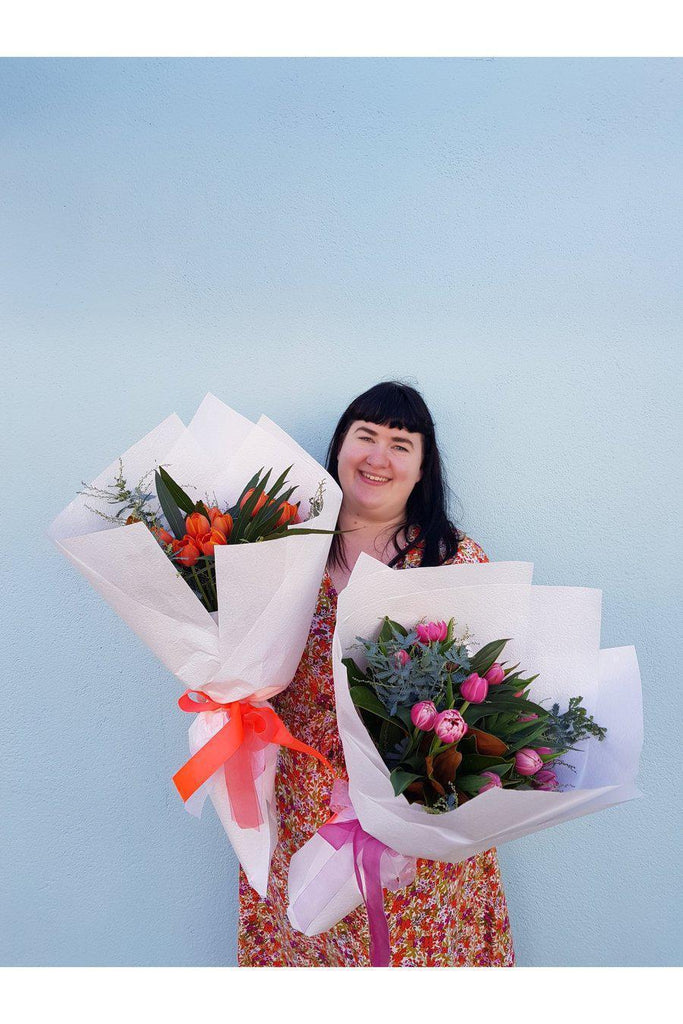 15 stems of beautiful  Tulips arranged with a touch of foliage, beautifully   wrapped with a ribbon.