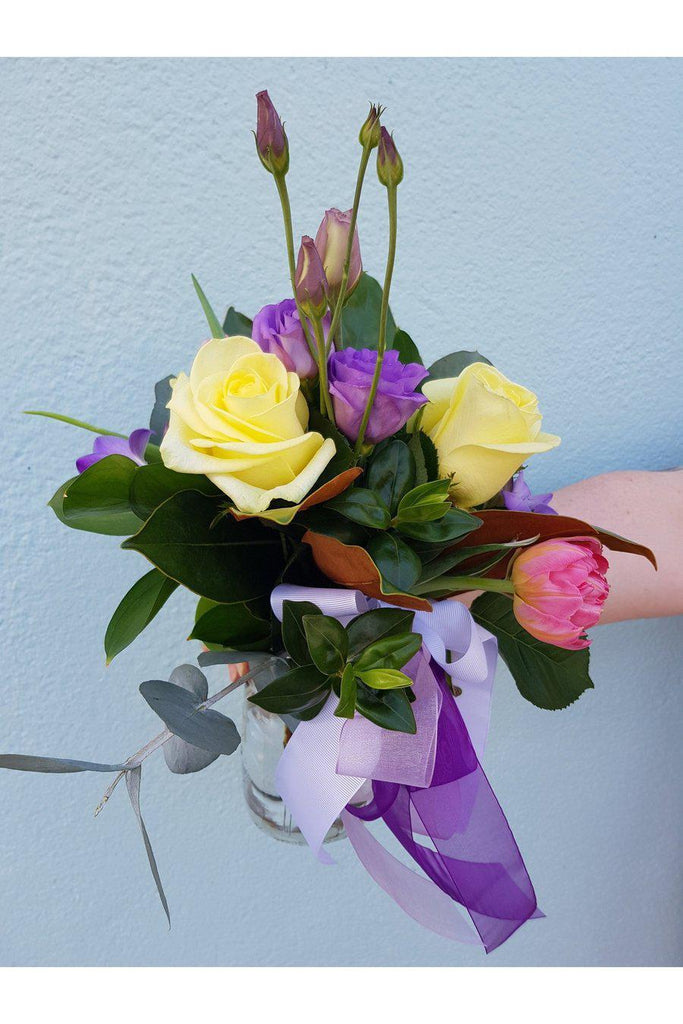 Pick A Posy ,A beautiful posy arranged in a mason jar. Let us work our magic and create something special for you from our beautiful range of seasonal flowers and foliage. This posy in a jar is beautifully wrapped, presented in a carry bag, sent with a gift card containing your own personal message, and wet wrapped on the stems’ ends to ensure freshness.- Wellington Florist Kilbirnie Florist Lyall Bay Florist