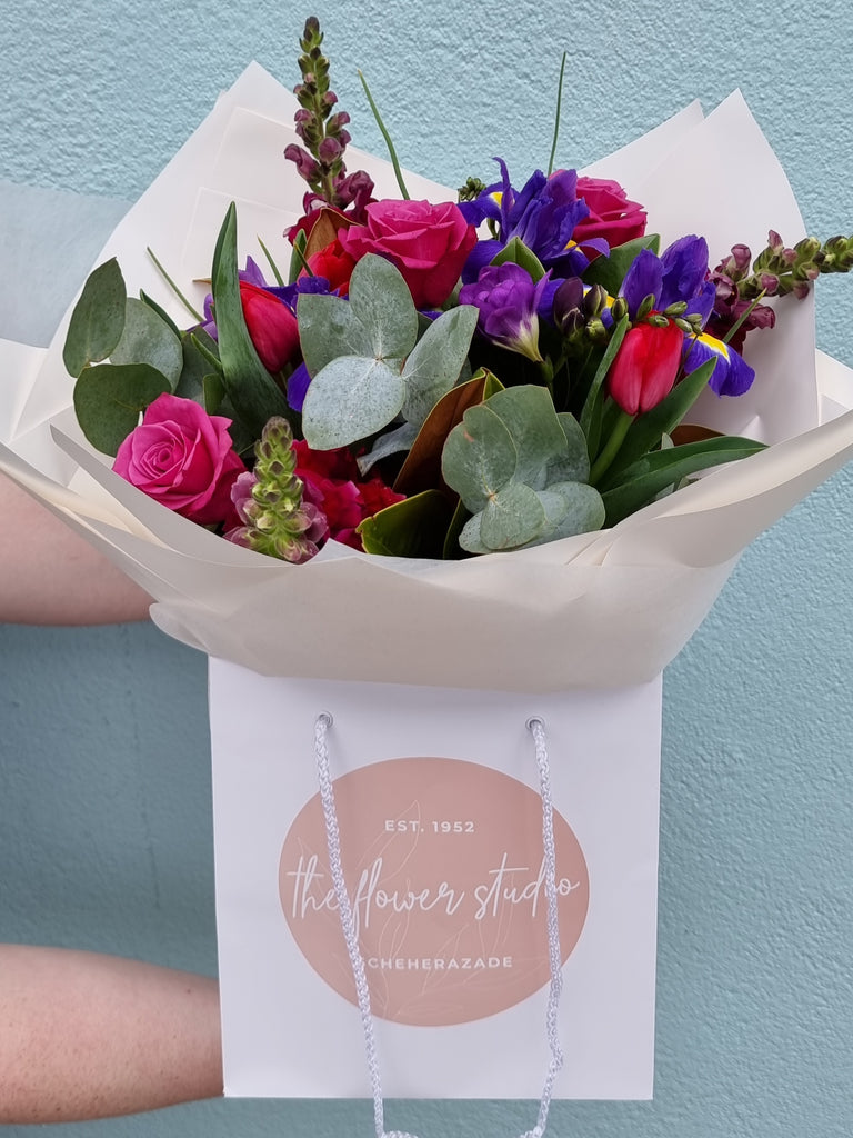 A stunning mix of purple's ,mauve's and deep pinks made from our seasonal range of fresh flowers.