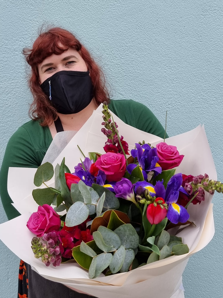 A stunning mix of purple's ,mauve's and deep pinks made from our seasonal range of fresh flowers.